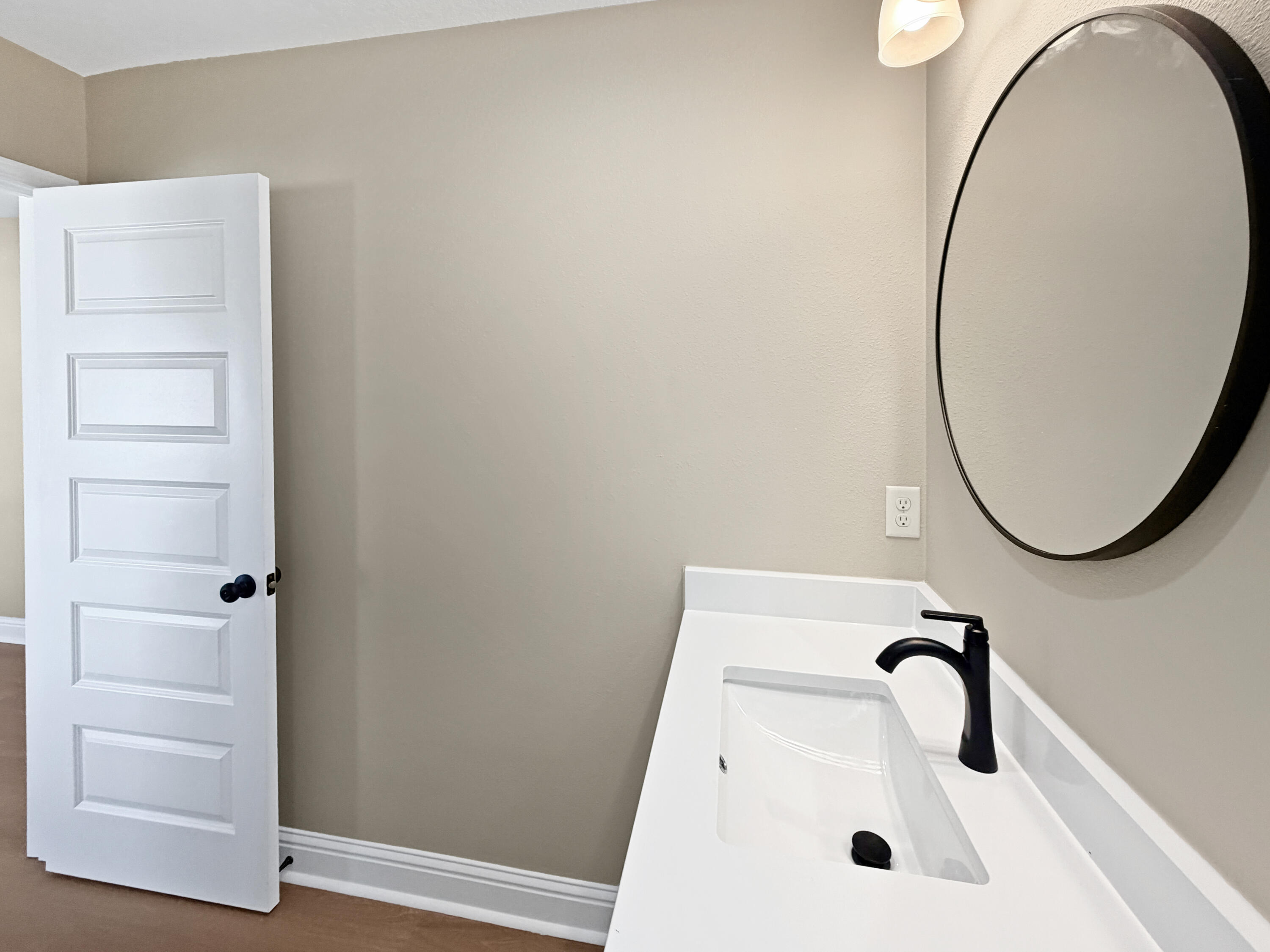 5356 Highview Drive Crestview, FL 32539 - Photo 16 of 18 a bathroom with a sink and a mirror