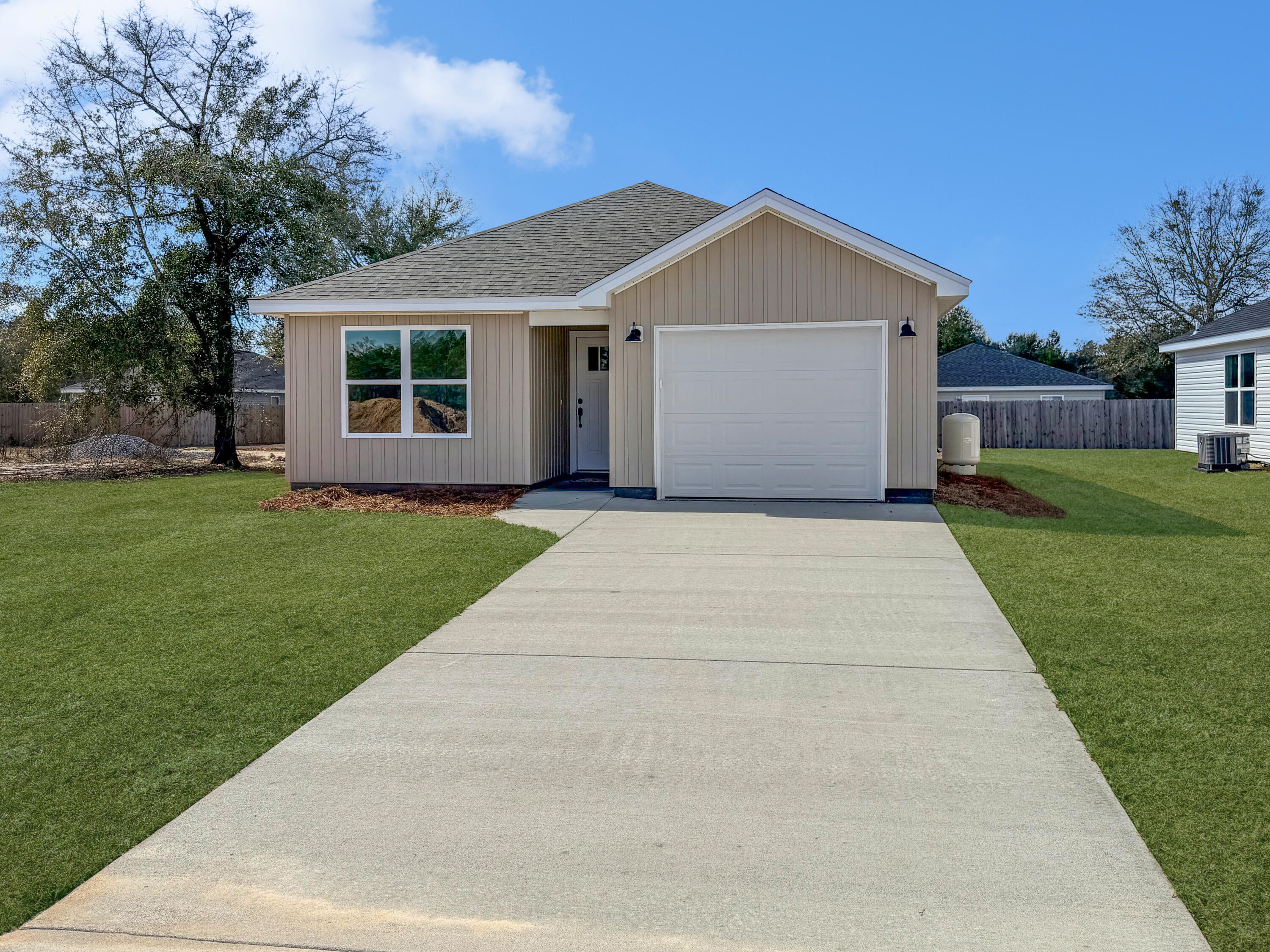 5356 Highview Drive Crestview, FL 32539 - Photo 2 of 18 a front view of a house with a yard and trees