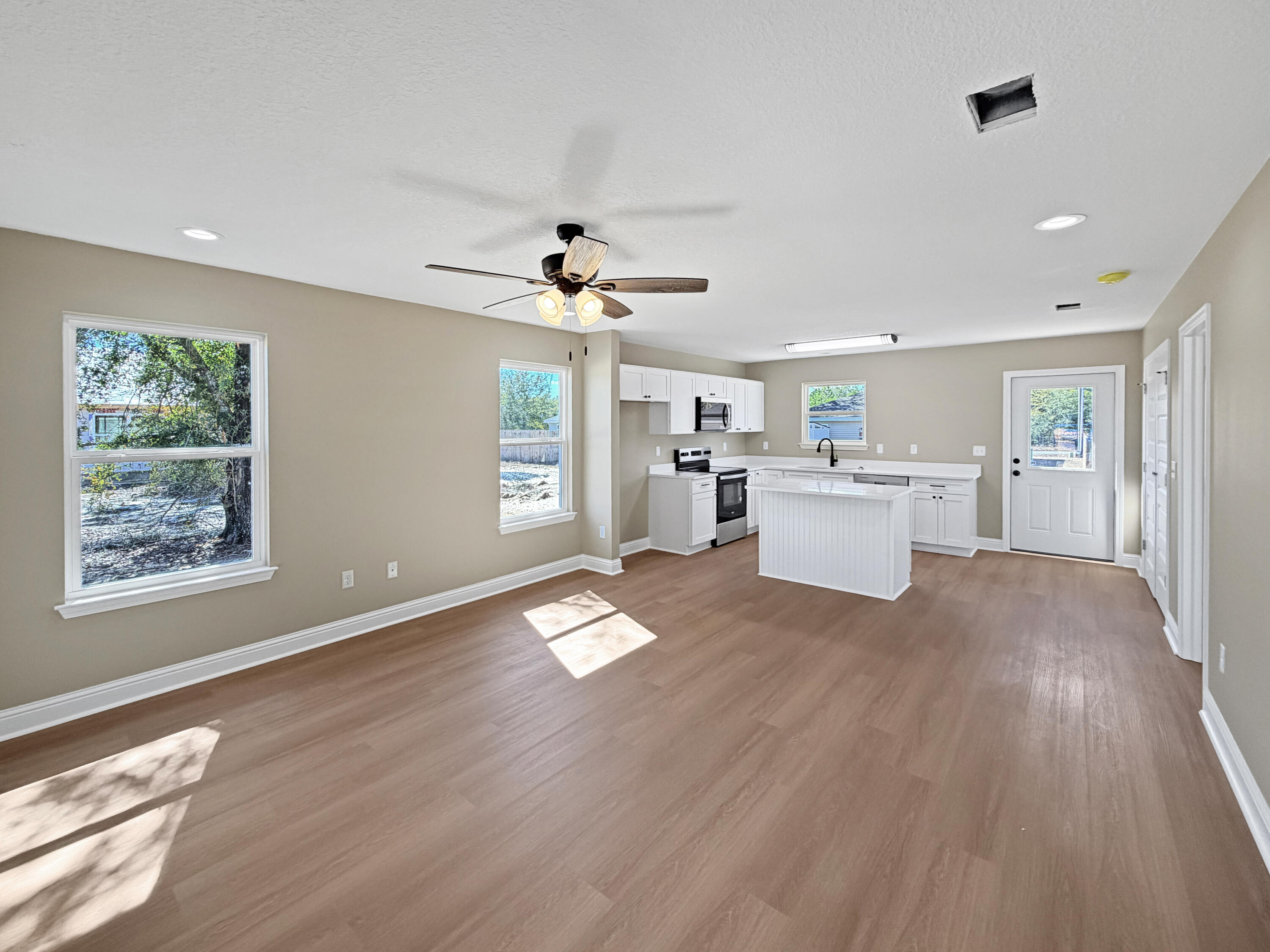 5356 Highview Drive Crestview, FL 32539 - Photo 3 of 18 a view of a room with a kitchen and windows