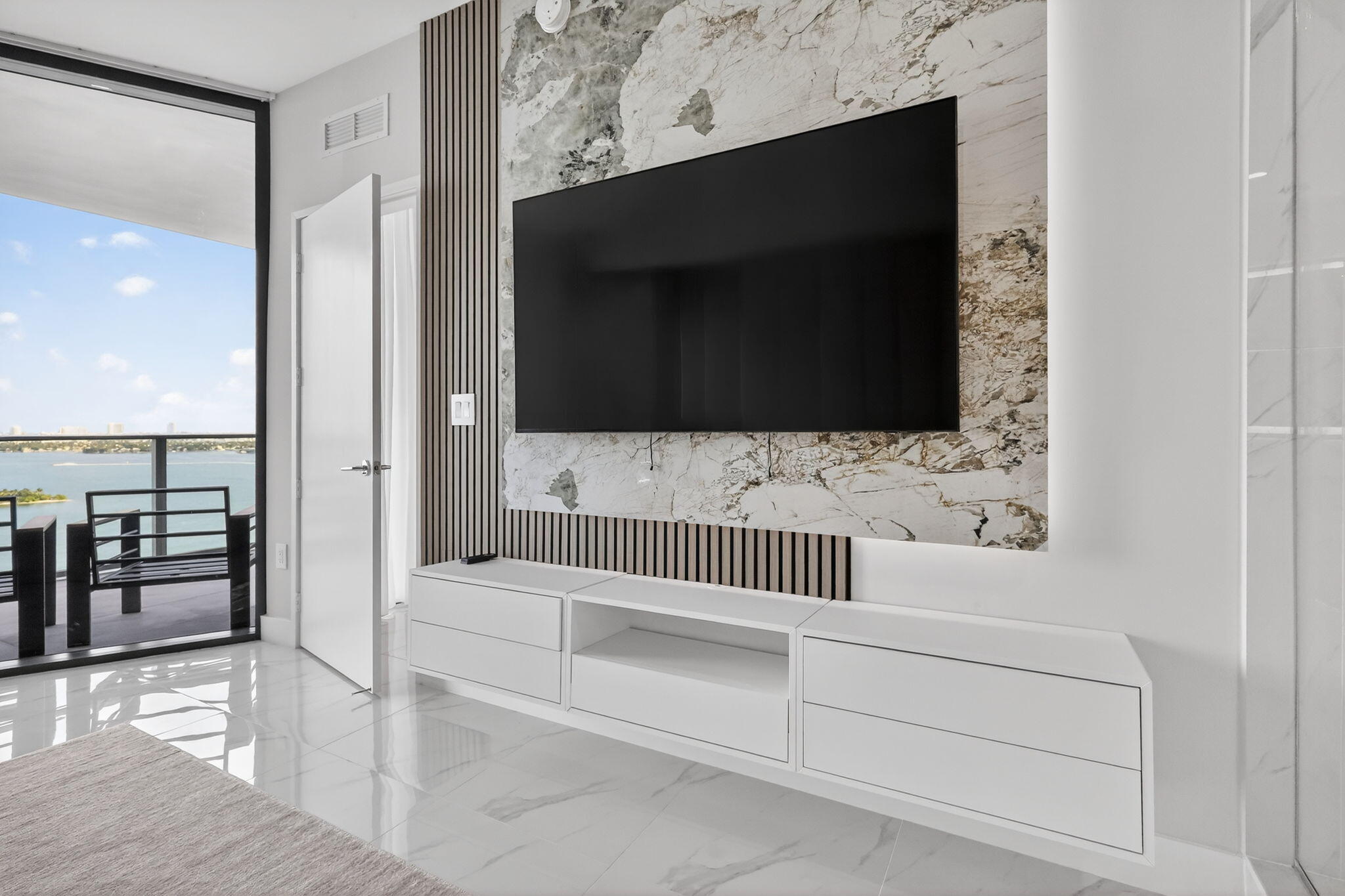 700 Northeast 23rd Street, Unit 2006 Miami, FL 33137 - Photo 1 of 34 a bathroom with a bathtub and a walk in closet