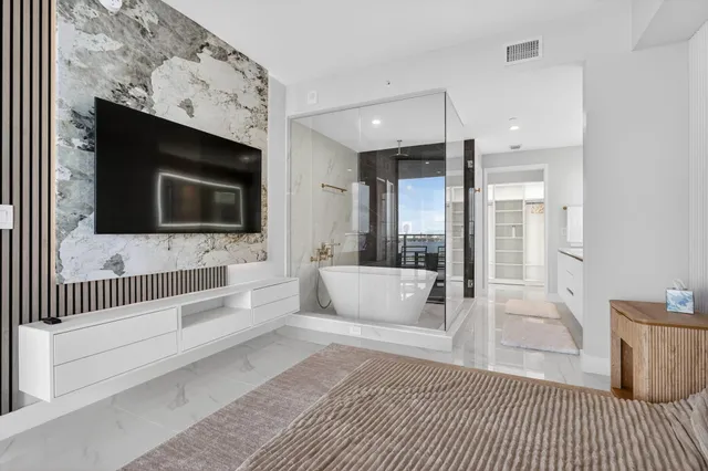 a bathroom with a sink a mirror and a bathtub