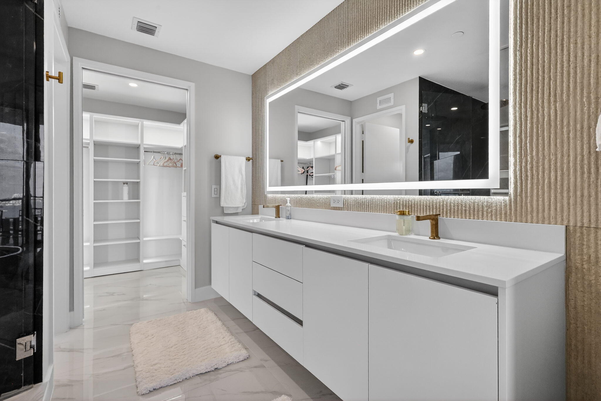 700 Northeast 23rd Street, Unit 2006 Miami, FL 33137 - Photo 15 of 34 a bathroom with a sink and a mirror