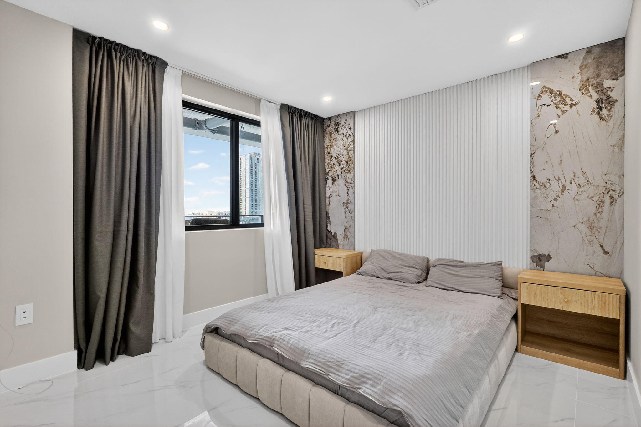 700 Northeast 23rd Street, Unit 2006 Miami, FL 33137 - Photo 18 of 34 a bedroom with a bed and a window