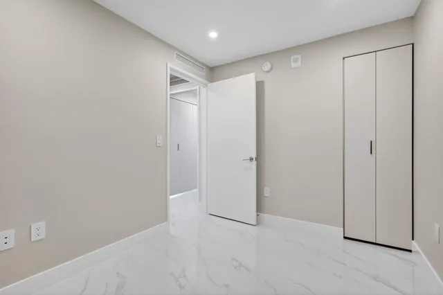 a view of a hallway with washer and dryer