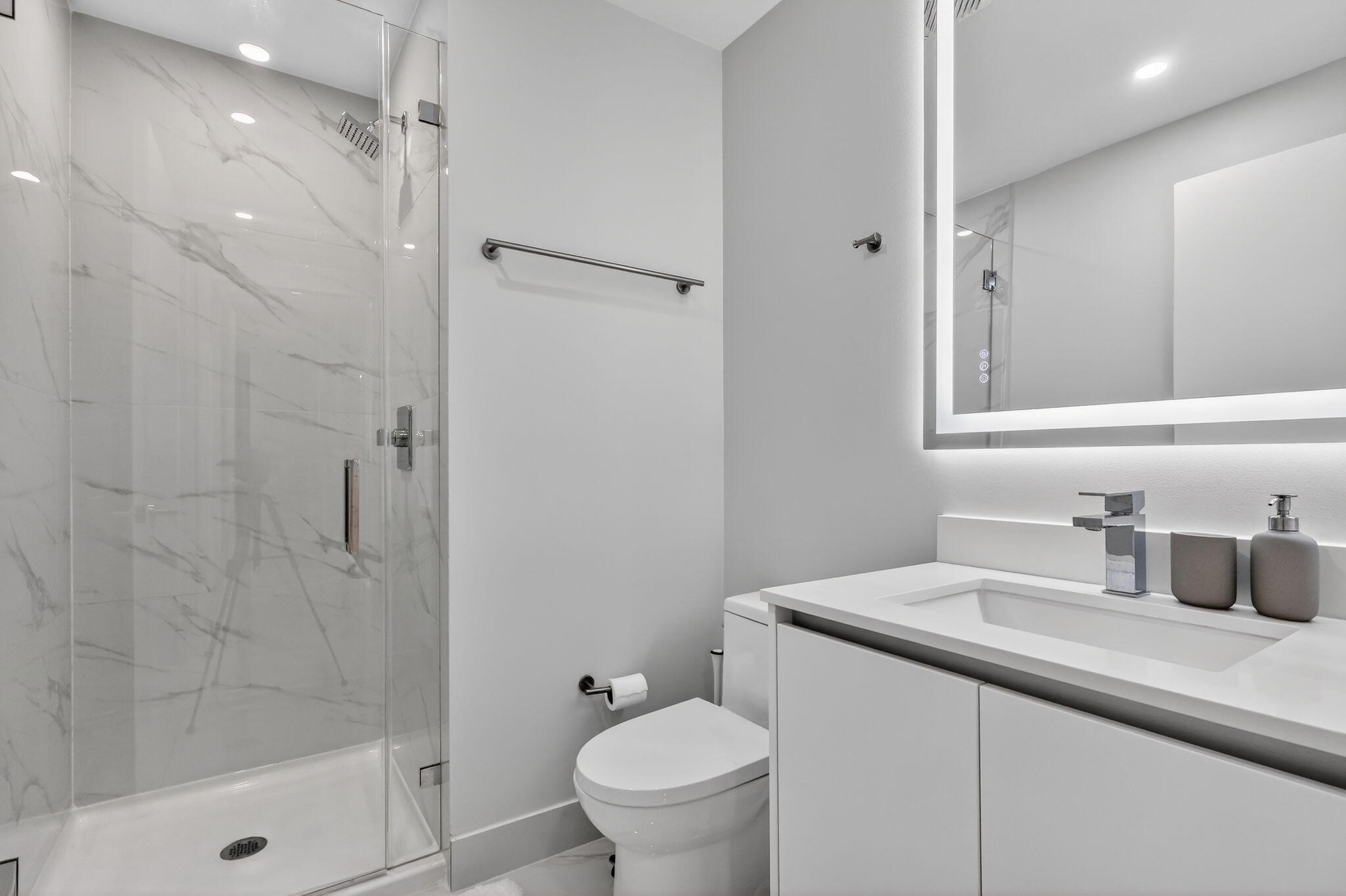 700 Northeast 23rd Street, Unit 2006 Miami, FL 33137 - Photo 24 of 34 a bathroom with a sink toilet and shower