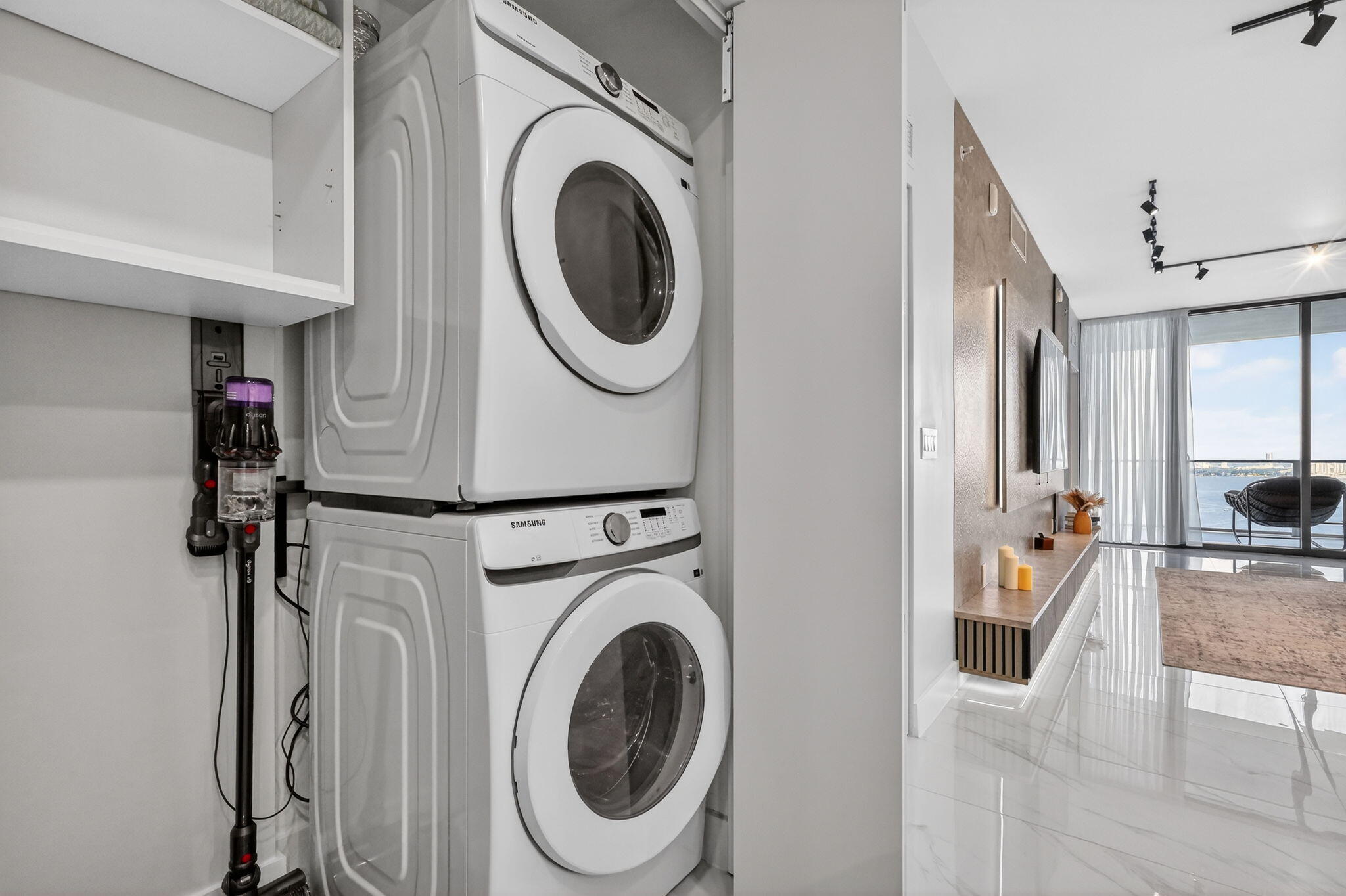 700 Northeast 23rd Street, Unit 2006 Miami, FL 33137 - Photo 25 of 34 a view of a hallway with washer and dryer