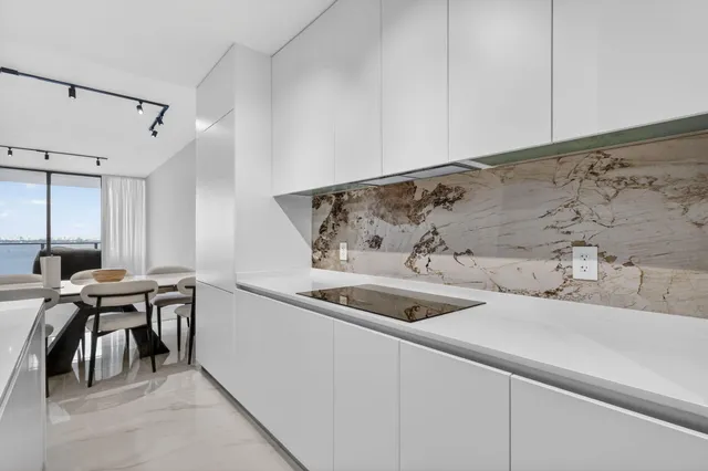 a kitchen with a sink and cabinets