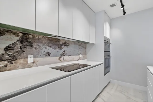 a kitchen with a sink and cabinets