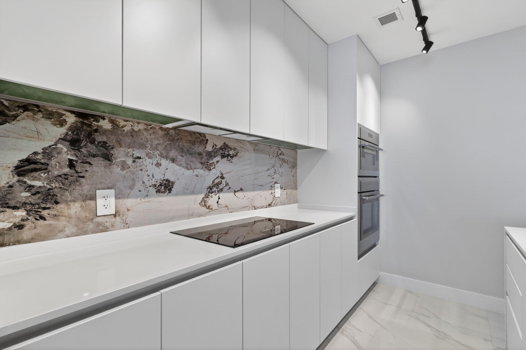 700 Northeast 23rd Street, Unit 2006 Miami, FL 33137 - Photo 5 of 34 a kitchen with a sink and cabinets