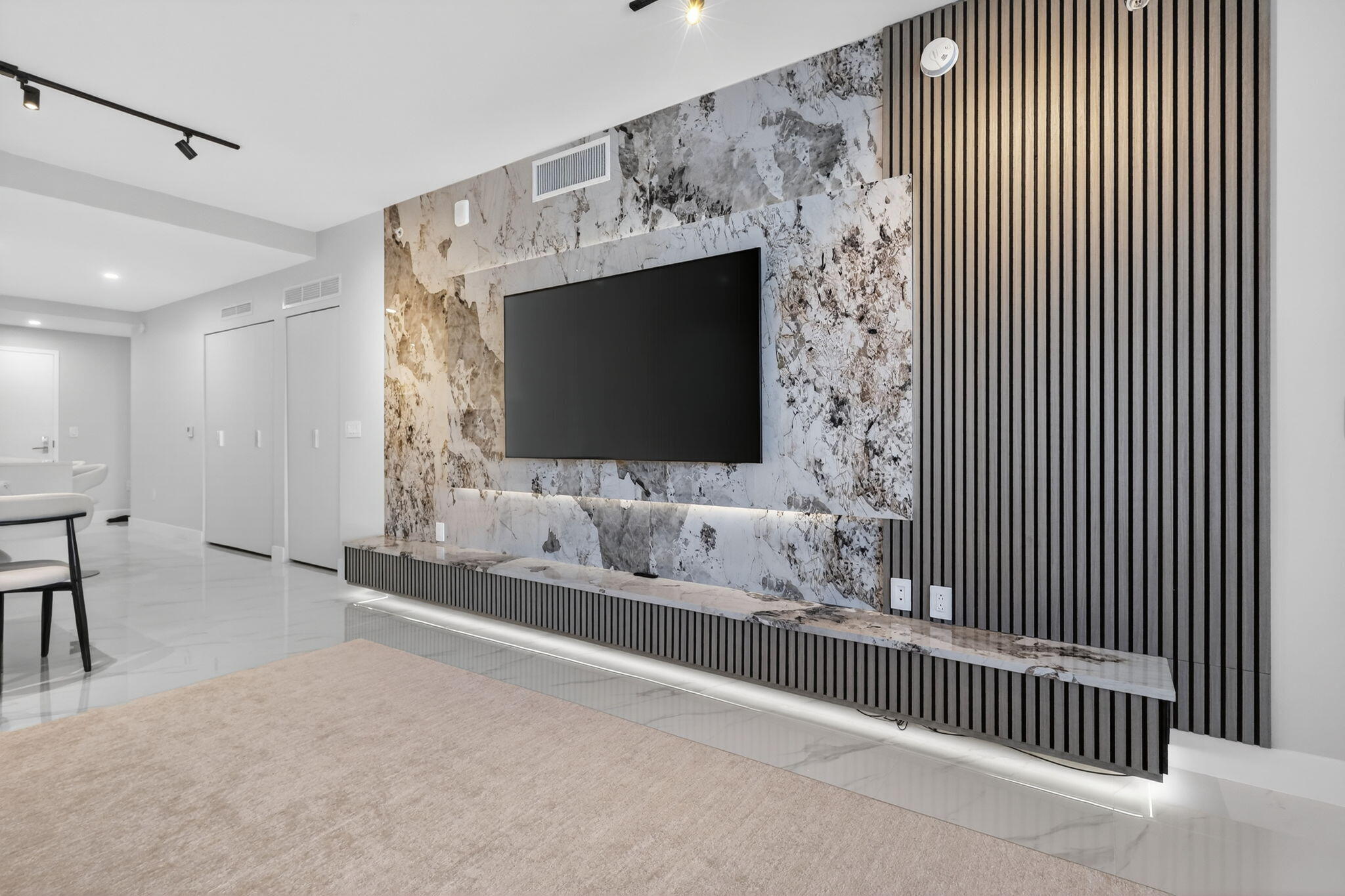 700 Northeast 23rd Street, Unit 2006 Miami, FL 33137 - Photo 8 of 34 a living room with furniture and a flat screen tv