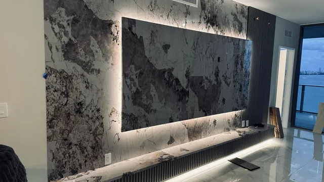 a view of a living room hardwood floor and a kitchen