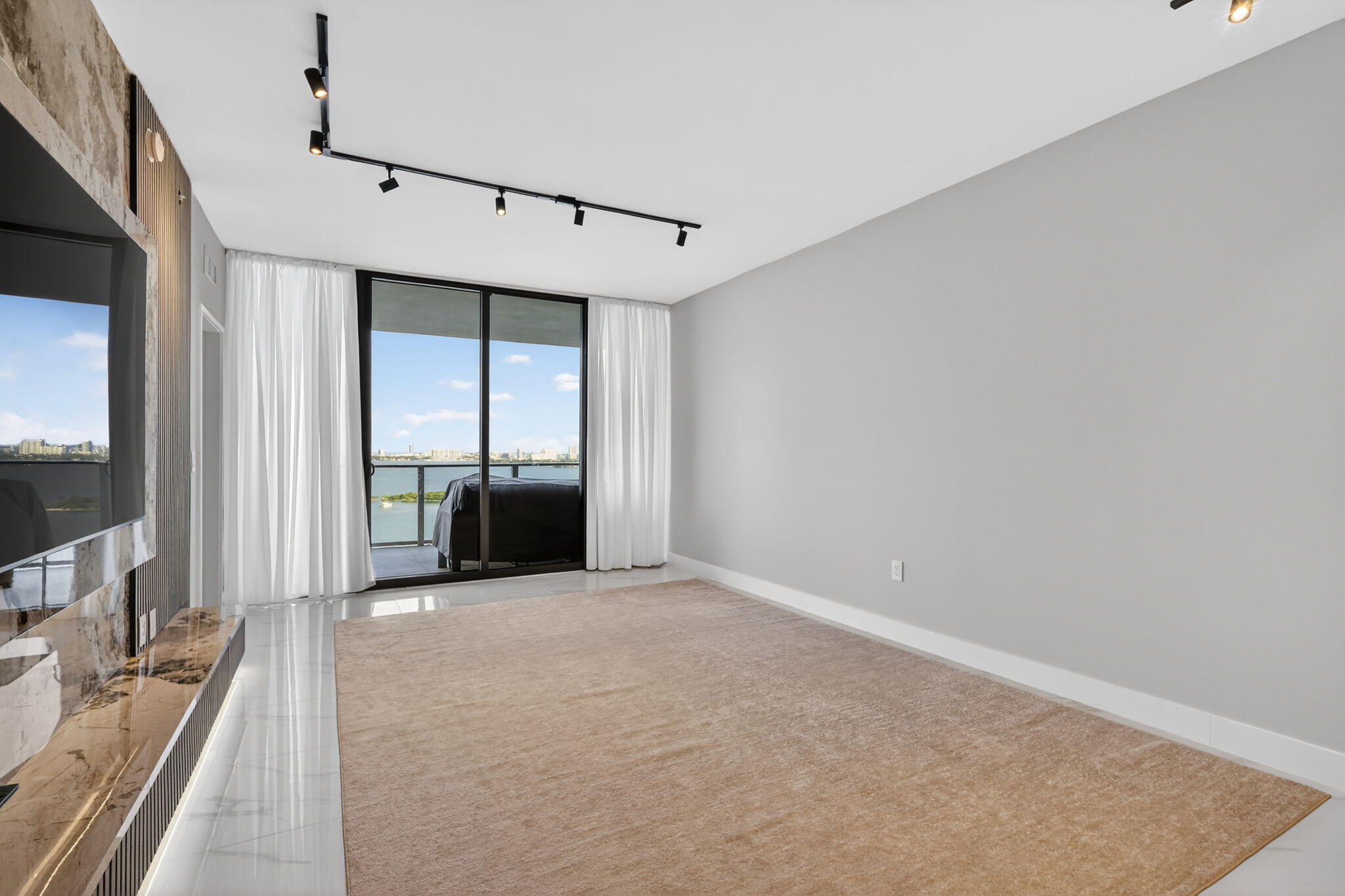 700 Northeast 23rd Street, Unit 2006 Miami, FL 33137 - Photo 10 of 34 a view of a living room hardwood floor and a kitchen
