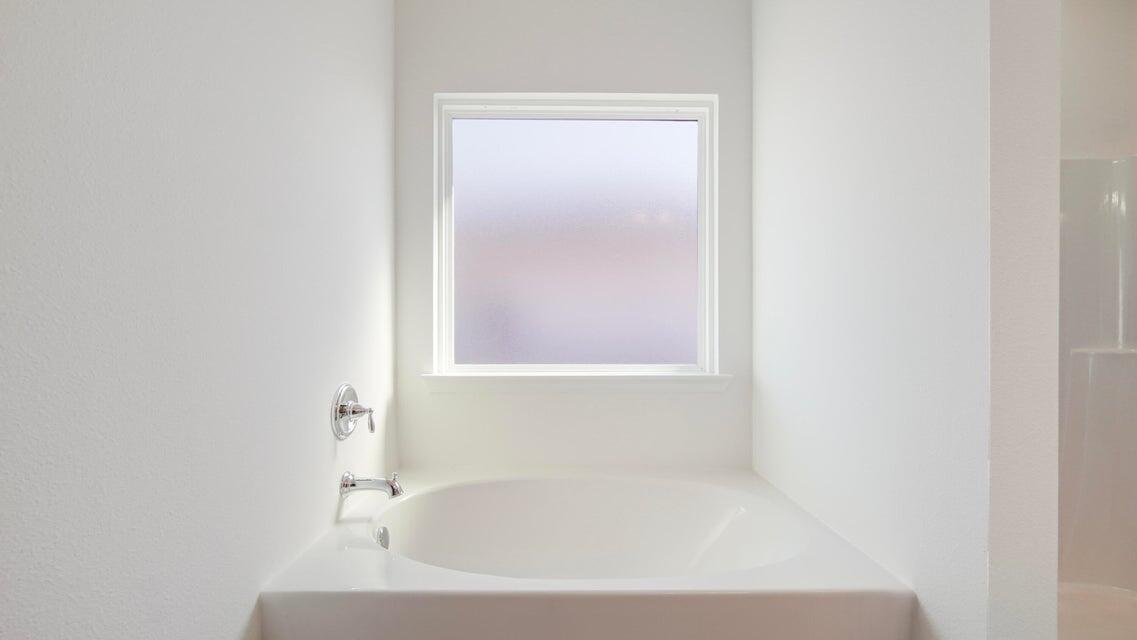 181 Huckleberry Street Freeport, FL 32439 - Photo 7 of 14 a white bath tub sitting next to a white sink