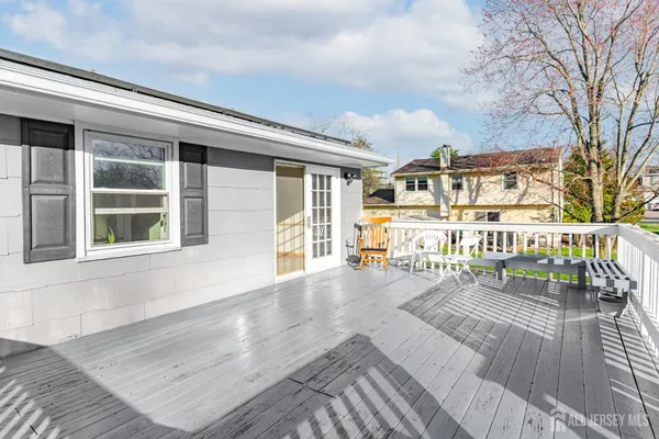 a view of a wooden deck with furniture