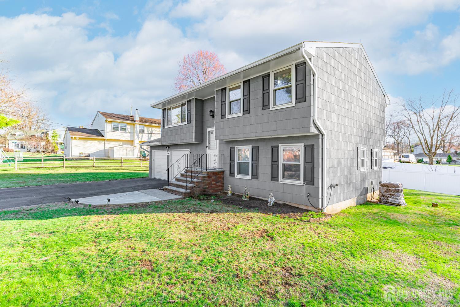 160 Stratton Street South Piscataway, NJ 08854 - Photo 2 of 31 a backyard of a house with table and chairs