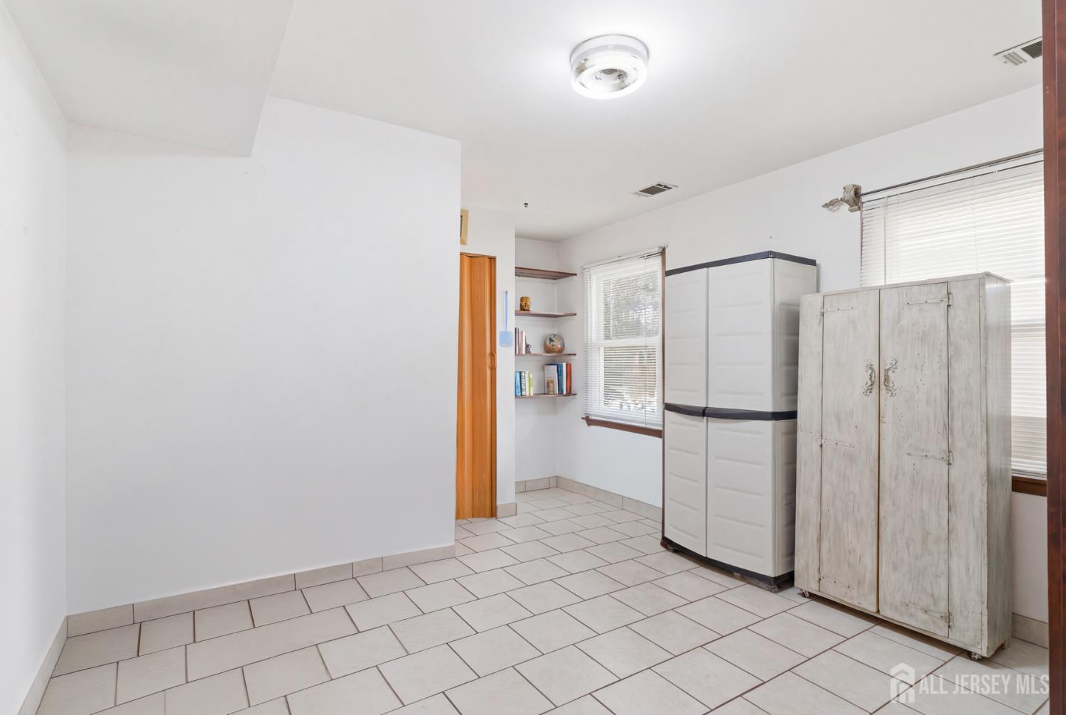 160 Stratton Street South Piscataway, NJ 08854 - Photo 27 of 31 a view of a refrigerator in kitchen and white cabinets