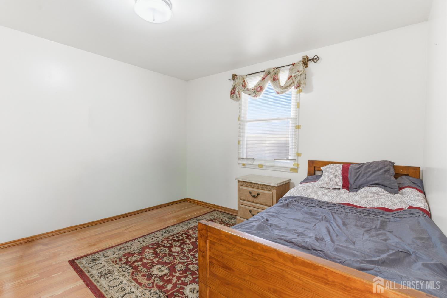 160 Stratton Street South Piscataway, NJ 08854 - Photo 28 of 31 a bedroom with a bed and a window