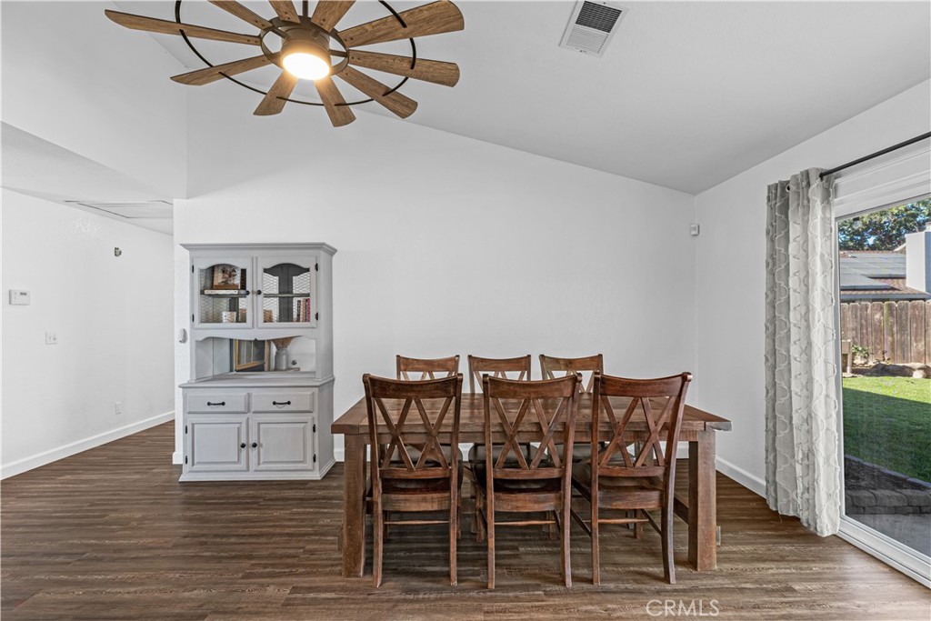 3585 Cabrillo Court Merced, CA 95348 - Photo 17 of 42 a view of a dining room with furniture and wooden floor
