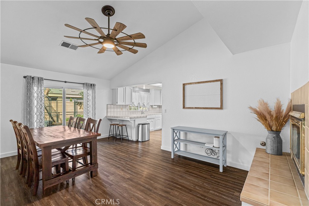 3585 Cabrillo Court Merced, CA 95348 - Photo 18 of 42 a view of a dining room with furniture window and wooden floor