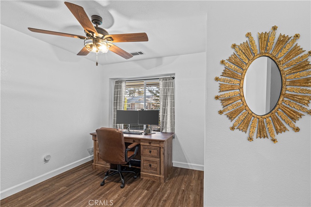 3585 Cabrillo Court Merced, CA 95348 - Photo 22 of 42 a view of a workspace with furniture and a window