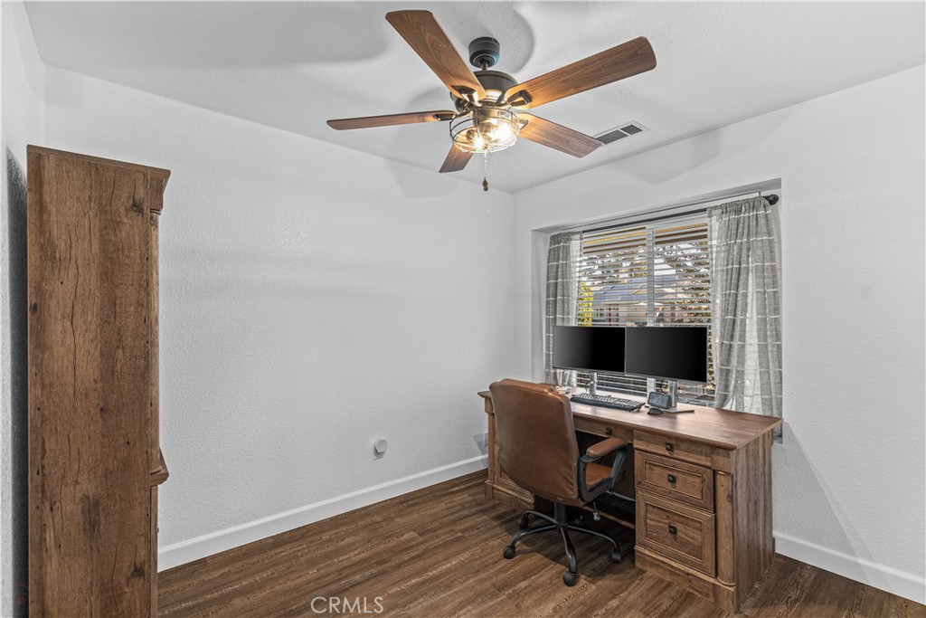 3585 Cabrillo Court Merced, CA 95348 - Photo 23 of 42 a view of workspace with wooden floor windows