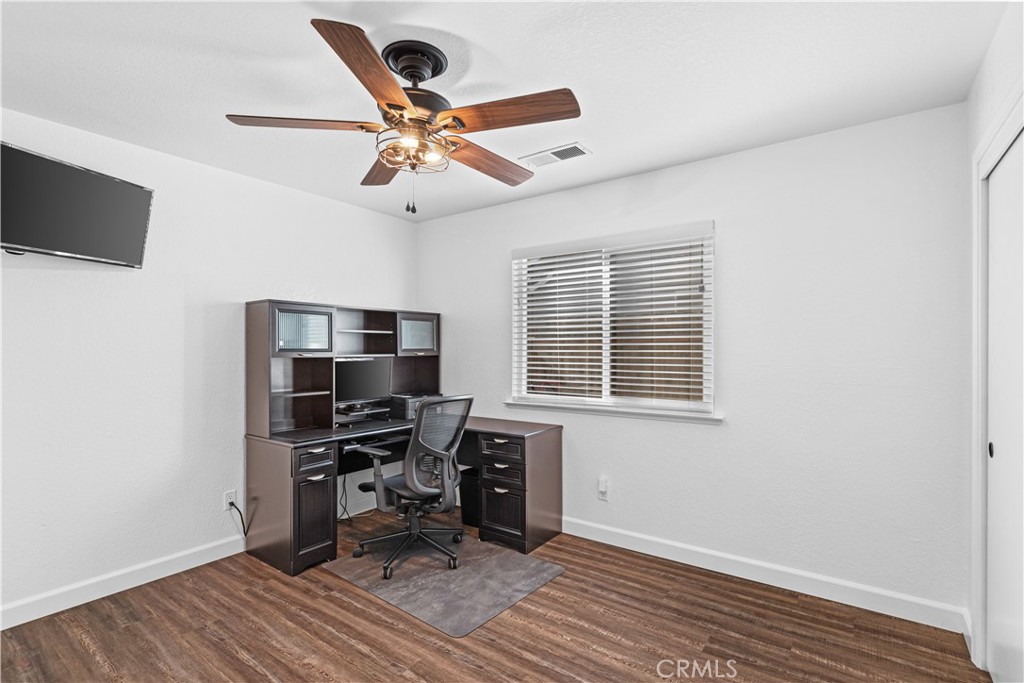 3585 Cabrillo Court Merced, CA 95348 - Photo 26 of 42 a view of a workspace with wooden floor and a window