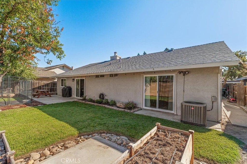 3585 Cabrillo Court Merced, CA 95348 - Photo 3 of 42 a front view of a house with a garden