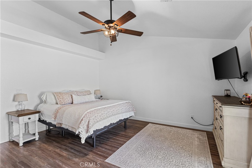 3585 Cabrillo Court Merced, CA 95348 - Photo 31 of 42 a bedroom with a bed and a flat screen tv