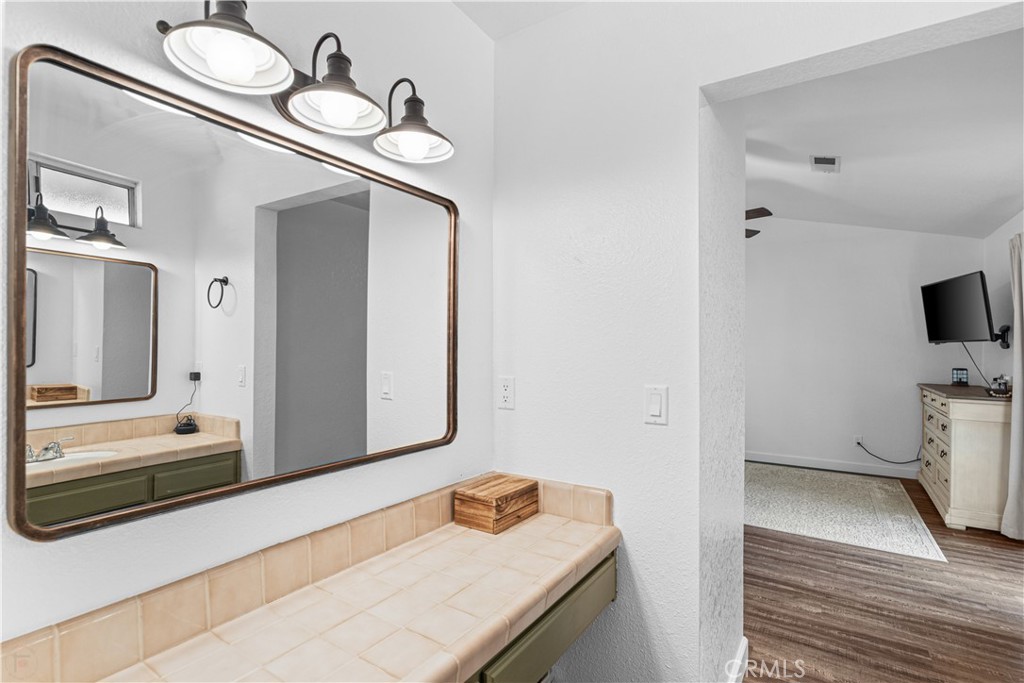 3585 Cabrillo Court Merced, CA 95348 - Photo 36 of 42 a bathroom with a sink and a mirror