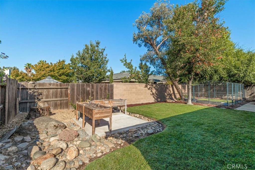 3585 Cabrillo Court Merced, CA 95348 - Photo 41 of 42 a view of a chair and table in backyard of the house