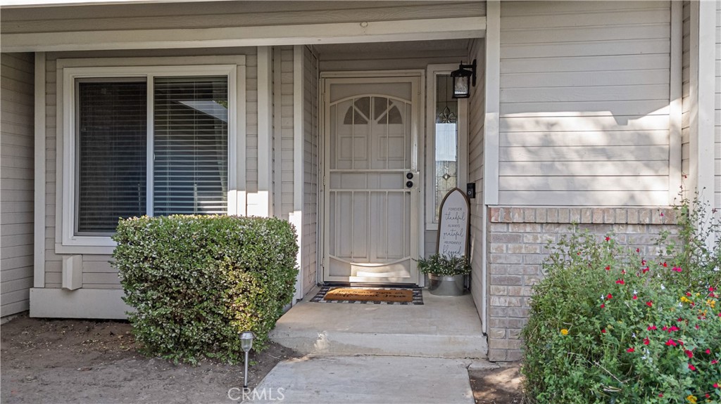 3585 Cabrillo Court Merced, CA 95348 - Photo 6 of 42 a front view of a house with a garden