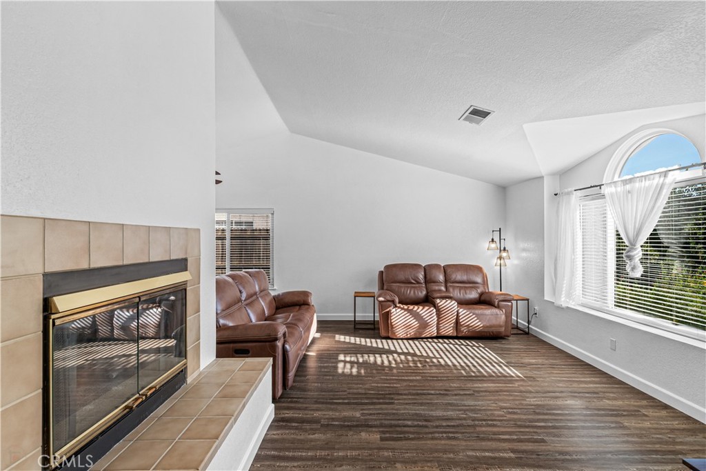 3585 Cabrillo Court Merced, CA 95348 - Photo 8 of 42 a bedroom with furniture and a fireplace