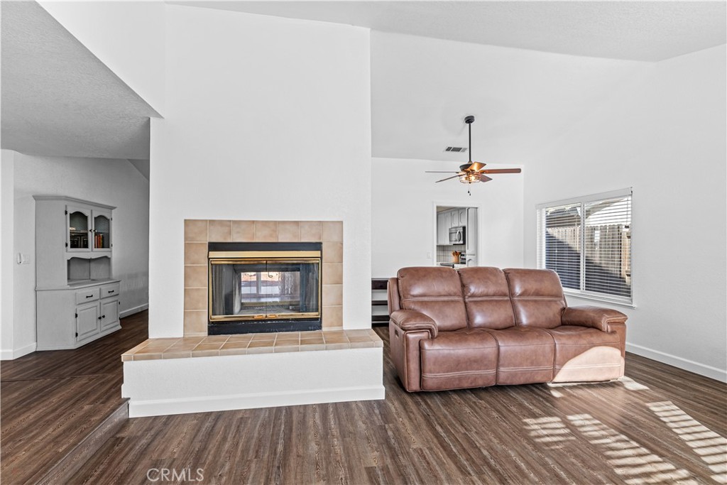 3585 Cabrillo Court Merced, CA 95348 - Photo 10 of 42 a living room with furniture and a fireplace
