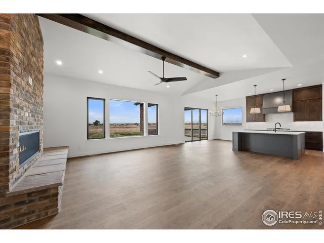 a view of kitchen with furniture and wooden floor