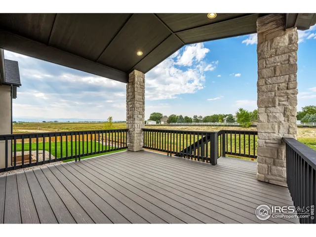 a view of balcony with wooden floor
