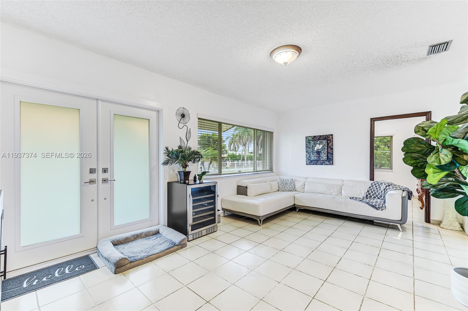 20890 Southwest 236th Street Homestead, FL 33031 - Photo 16 of 47 a living room with furniture and a window