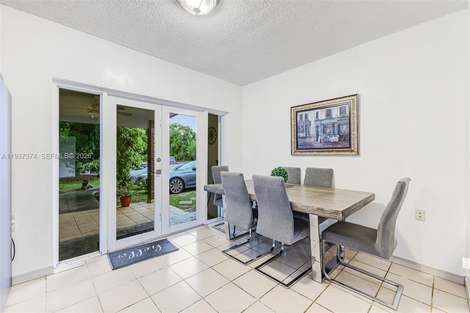 20890 Southwest 236th Street Homestead, FL 33031 - Photo 19 of 47 a dining room with furniture and floor to ceiling window