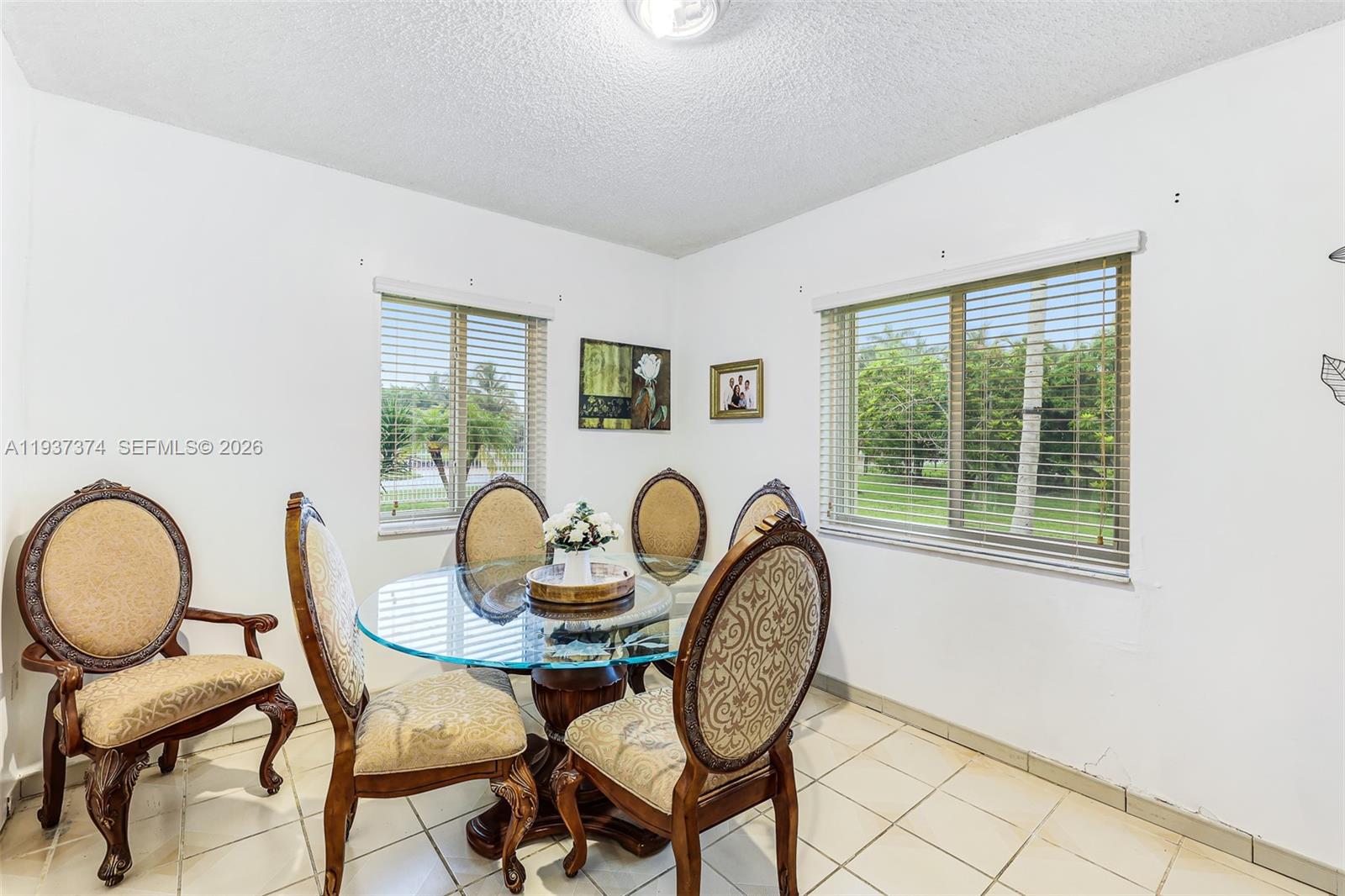 20890 Southwest 236th Street Homestead, FL 33031 - Photo 23 of 47 a table and chairs in a room