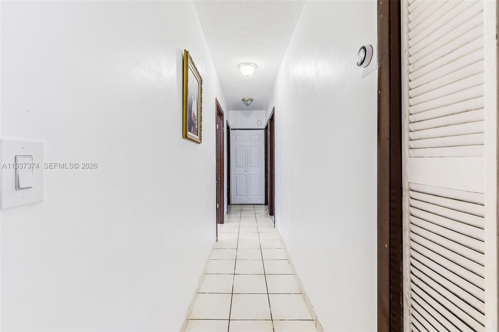 20890 Southwest 236th Street Homestead, FL 33031 - Photo 26 of 47 a view of a hallway