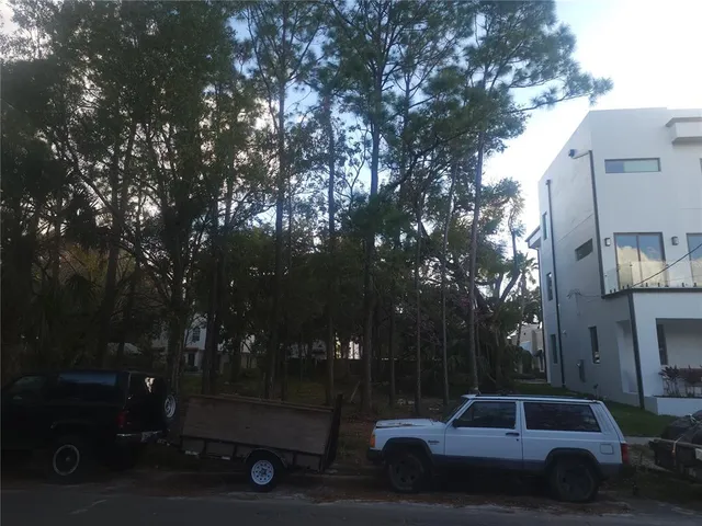 a view of street with parked cars