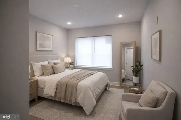 a bedroom with bed and furniture