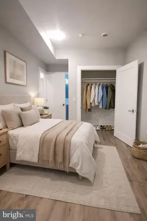 a bedroom with a large bed and a couch