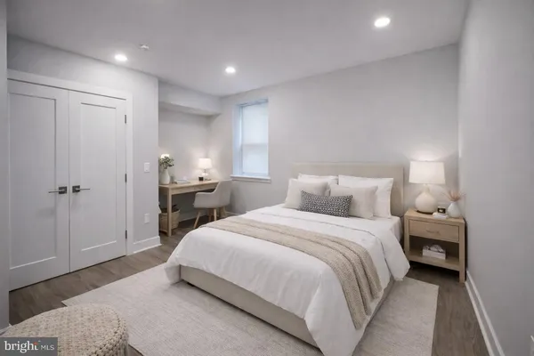 a spacious bedroom with a bed and a table