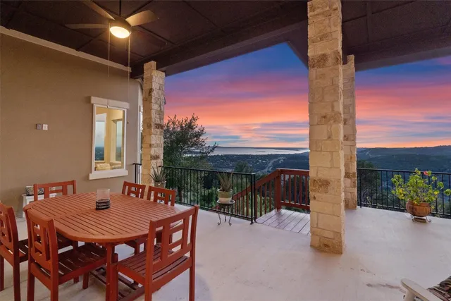 a view of a patio with a table and chairs