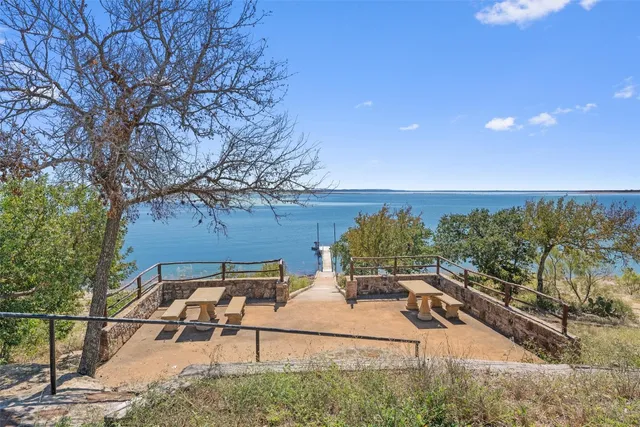 a view of a backyard with sitting area