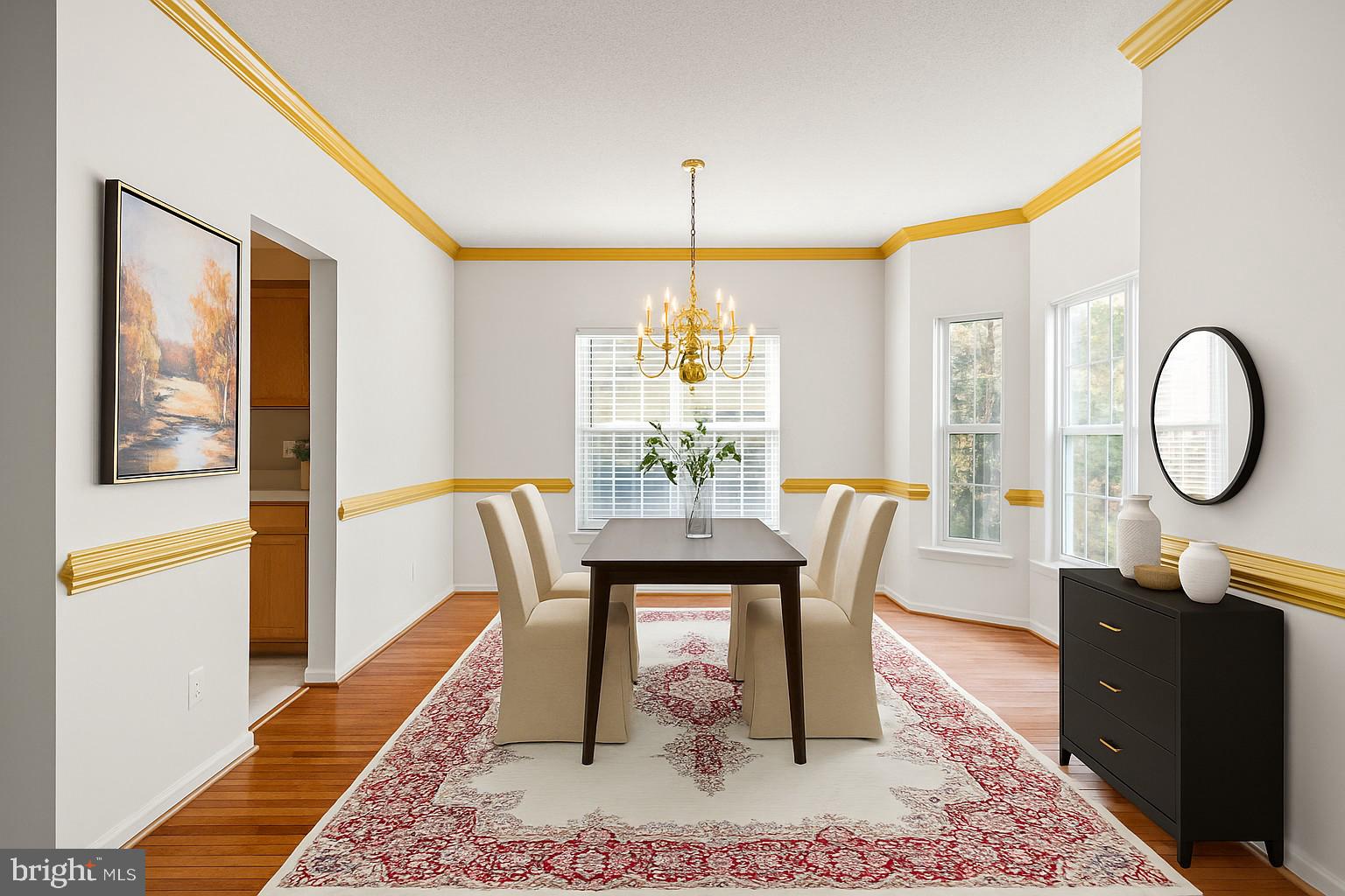 14760 Peach Tree Lane King George, VA 22485 - Photo 12 of 40 a dining room with furniture a rug and a chandelier