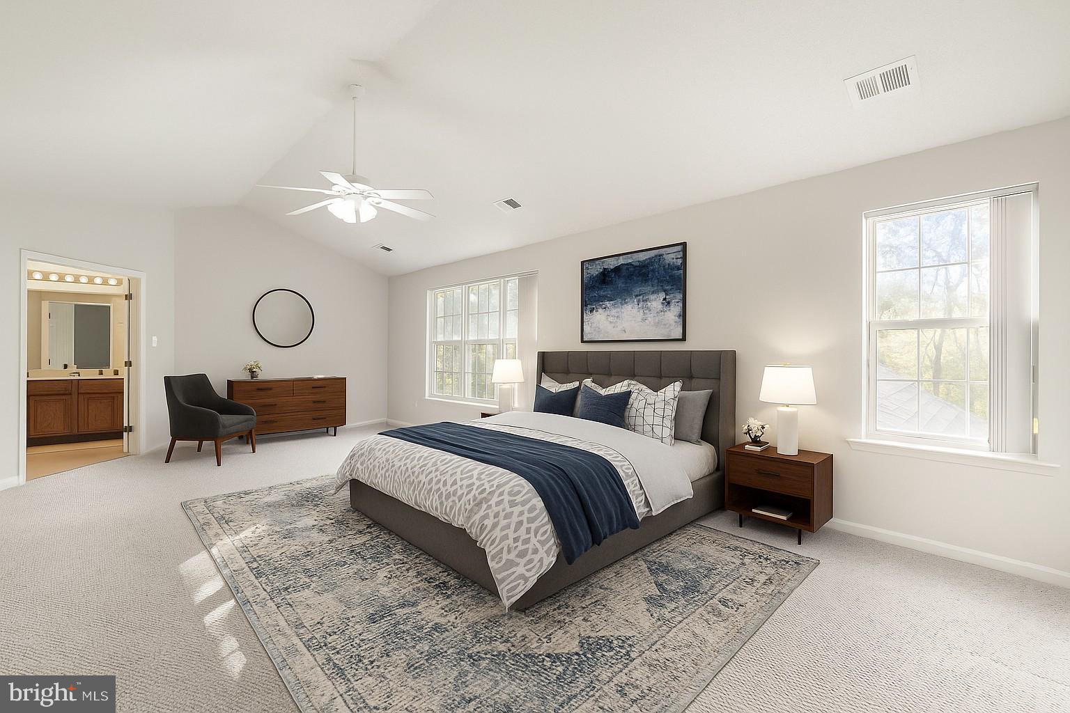 14760 Peach Tree Lane King George, VA 22485 - Photo 16 of 40 a spacious bedroom with a bed a chandelier and a window