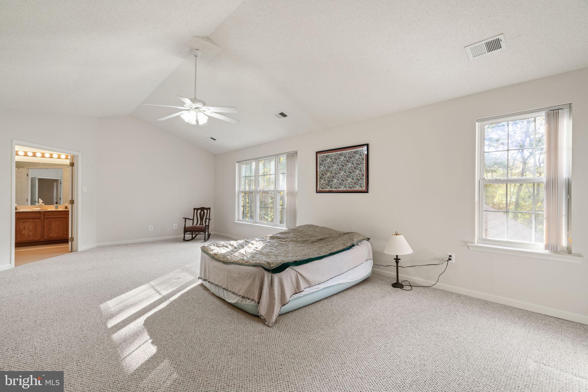 14760 Peach Tree Lane King George, VA 22485 - Photo 17 of 40 a spacious bedroom with a bed and window