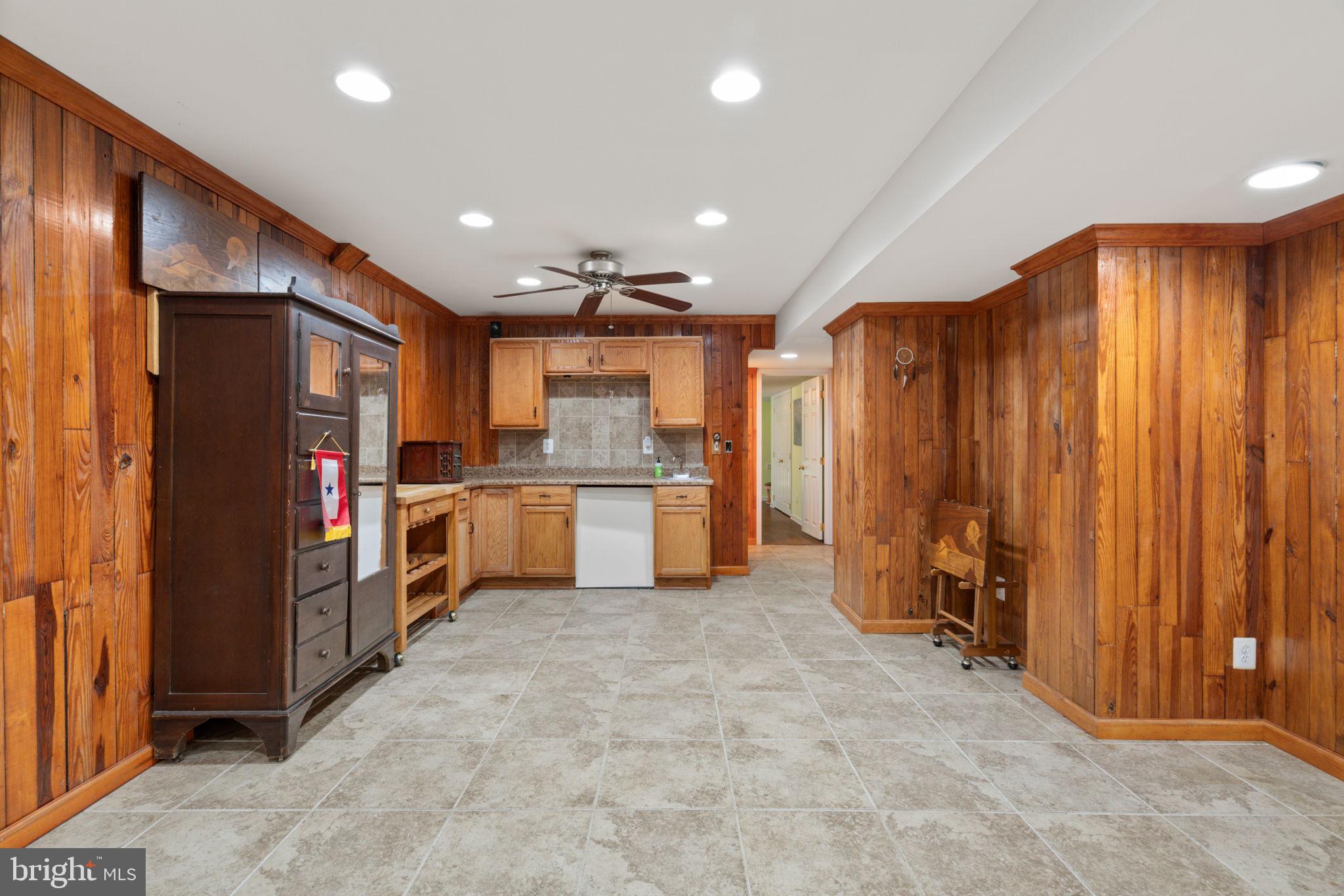 14760 Peach Tree Lane King George, VA 22485 - Photo 30 of 40 a kitchen with refrigerator and cabinets