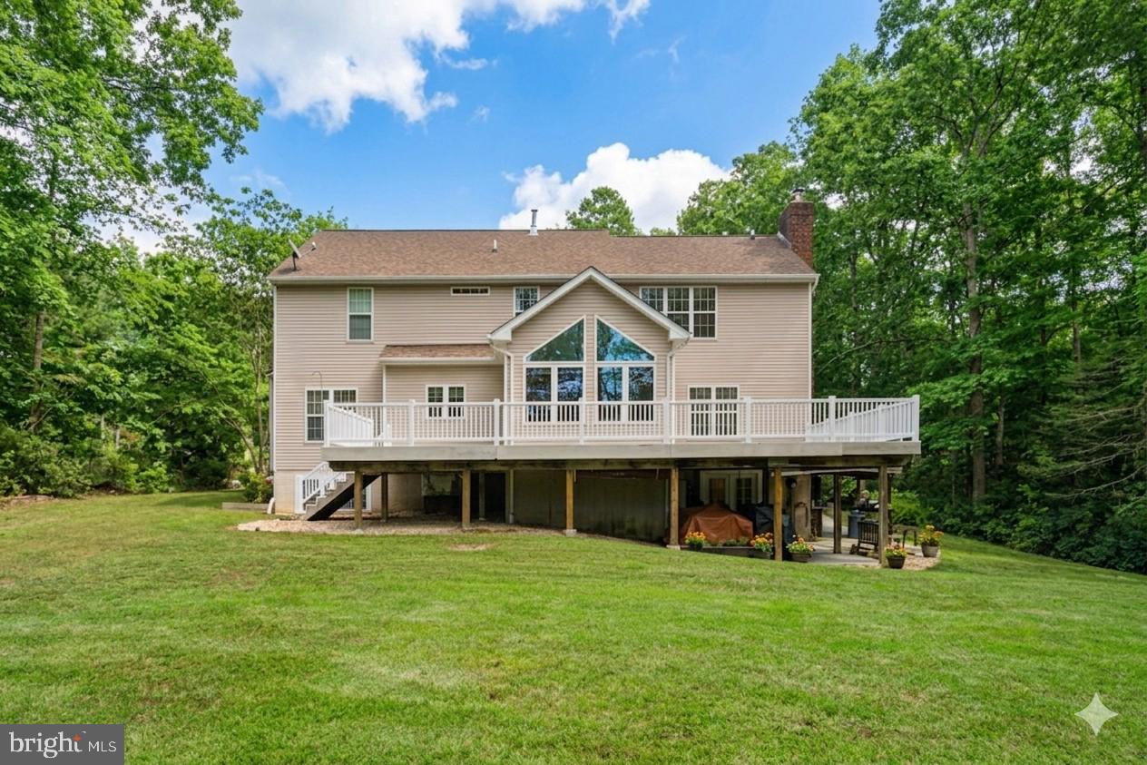 14760 Peach Tree Lane King George, VA 22485 - Photo 35 of 40 a front view of a house with a garden
